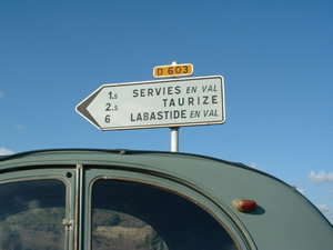 signpost pointing to the three gites in Servies en Val, Aude.